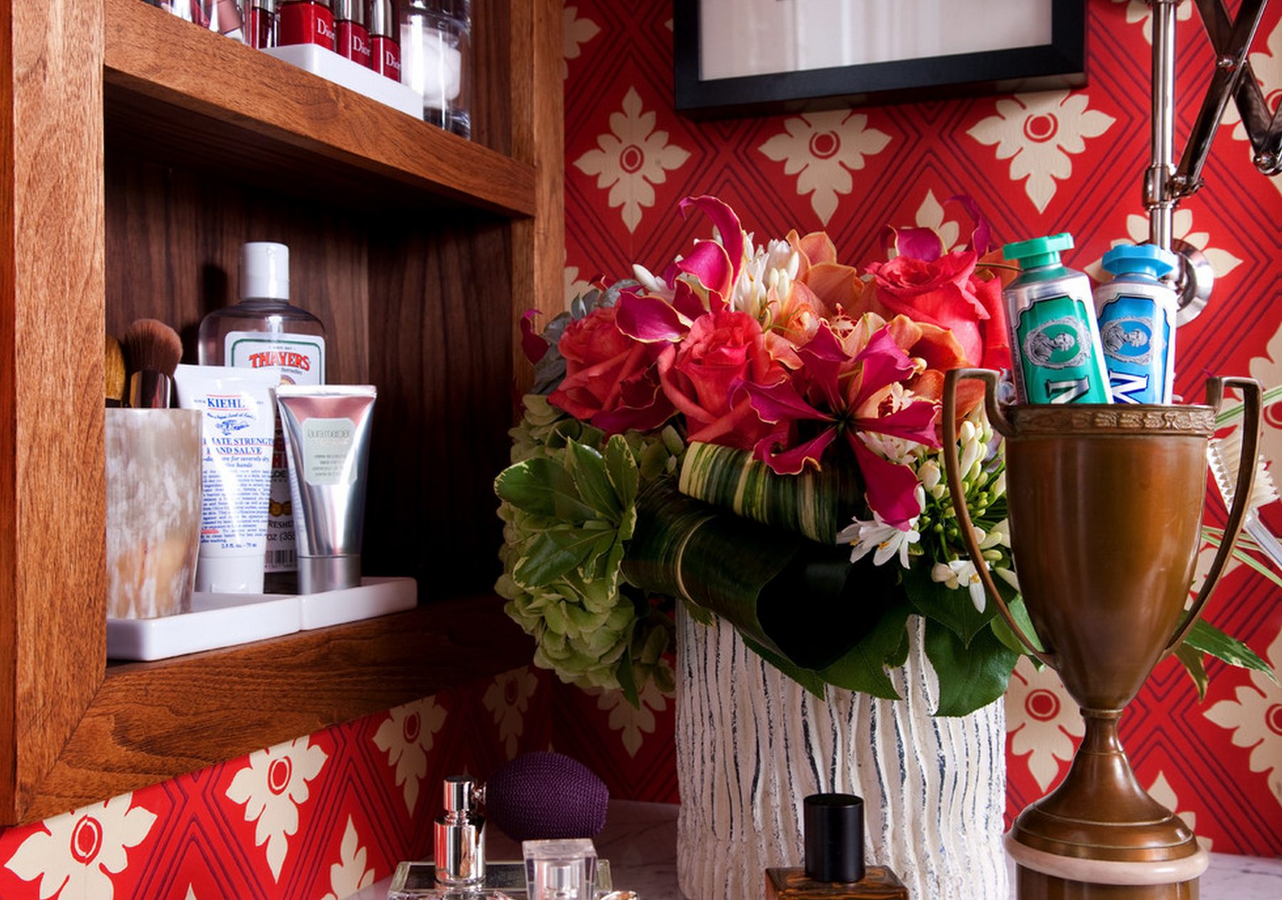 The Scarlet Bath — red ikat wallpaper, walnut vanity, and marble mosaic at the DC Design House by Christopher Patrick Interiors
