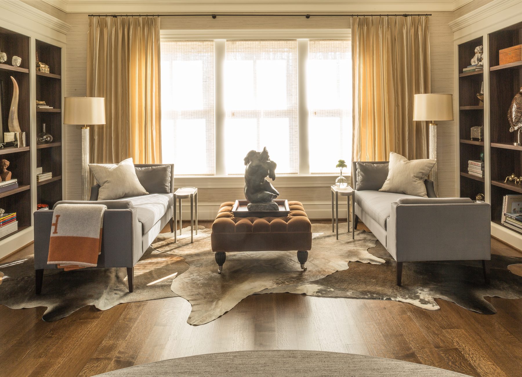 Tailored study and suite with lacquered walls, tobacco leather, and brass — DC Design House by Christopher Patrick Interiors